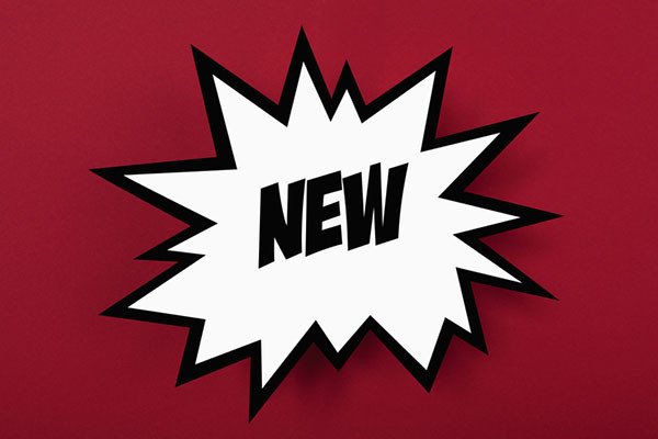 illustration of the word new written in comic book style lettering, centered in a white burst on a red background